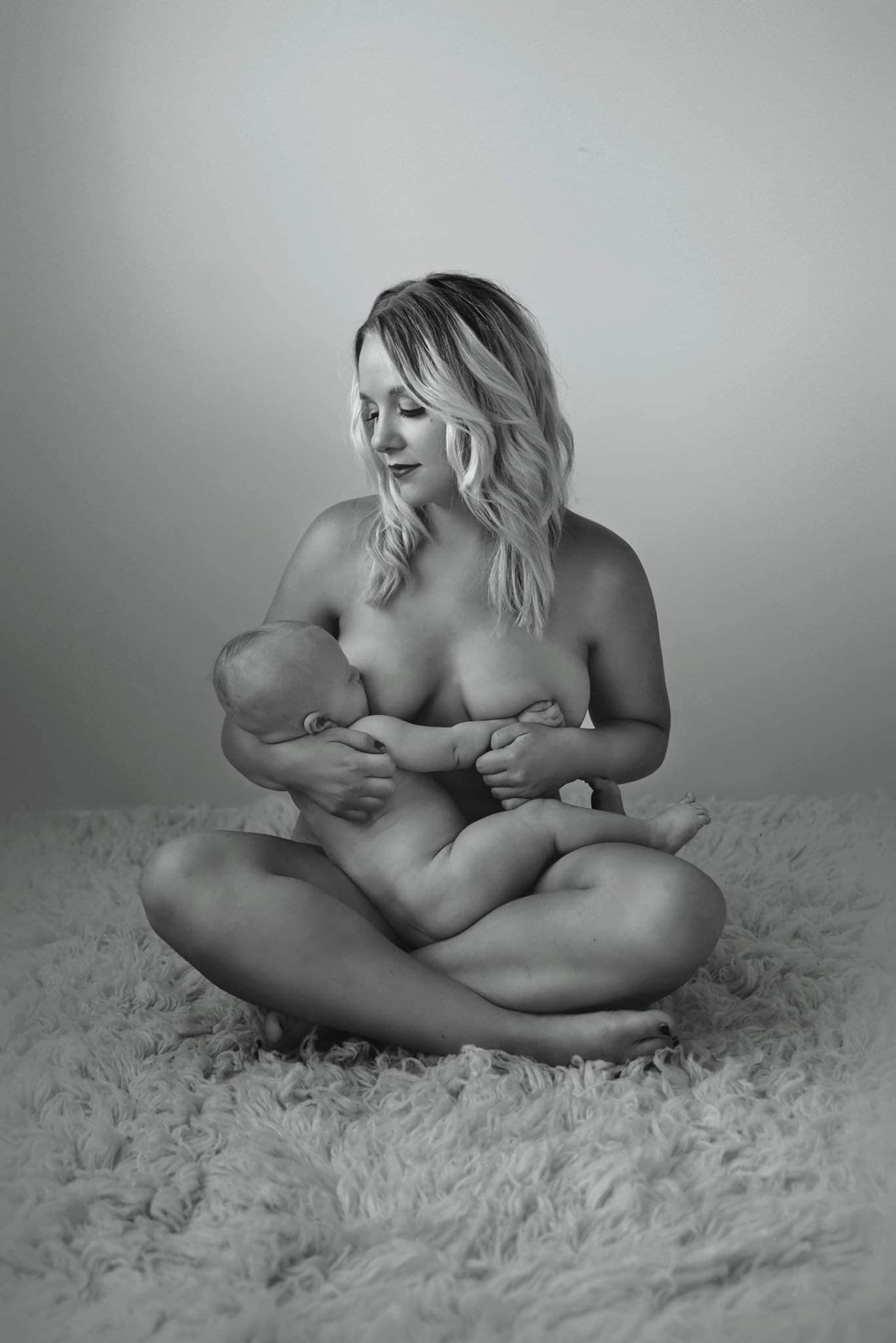 Bethany cradling her child — a quiet, intimate portrait of motherhood